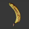 Yellow Banana With Brown Spots On Black Background Showing Reflective Surface