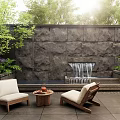 Tranquil Garden Featuring Stone Wall Waterfall Outdoor Chairs Small Table And Lush Plants