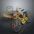 Vintage Iron Round Table And Chair With Yellow Bicycle Colorful Basket And Plant
