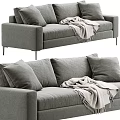 Gray Upholstered Two Seater Sofa With Soft Pillows And Knit Blanket