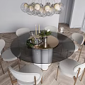Modern Round Glass Top Dining Table Set With Gold Base Light Colored Chairs And Chandelier
