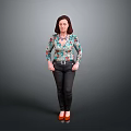 Woman in Floral Blouse Black Pants and Red High Heels Standing Against Gray Background