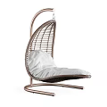 Modern Wicker Swing Chair with Metal Stand and White Cushion for Comfortable Relaxation