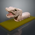 Stone Crocodile Sculpture With Open Mouth And Scaled Texture On Green Base