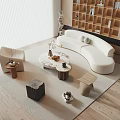 White Curved Sofa and Coffee Table Set in Modern Living Room with Rug and Decor