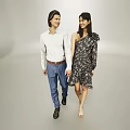 Two People Holding Hands Walking In Gray Background With White Shirt And Floral Dress
