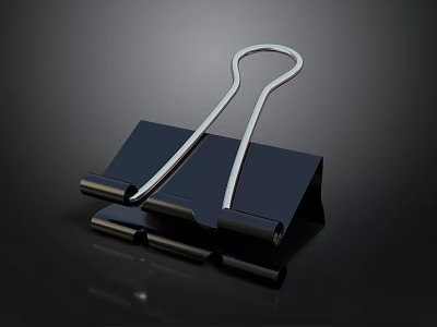 Silver Metal Paper Clip With Black Base And Reflective Surface For Office Use 3d model
