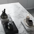 Minimalist Modern Tabletop Decor With Black Bottles Books And Bulb Decor On Marble Surface