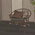 Rattan Leisure Chair With Brown Cushion Wooden Floor And Green Plant Setting