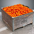 Abundant Fresh Orange Fruits in a Wooden Crate on Cracked Concrete Surface