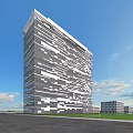 Modern High Rise Building With Unique Geometric Facade Green Lawn And Blue Sky