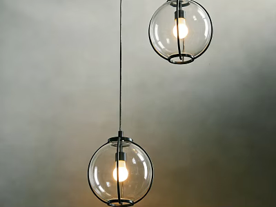Two Glass Globe Pendant Lights Hanging Against Gray Wall With Illuminated Bulbs 3d model