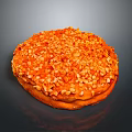Golden Brown Round Pastry Topped with Crushed Nuts and Sweet Glaze