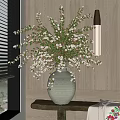 Gray Stone Vase With White Blossoms And Green Leaves On Window Sill