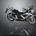 White And Blue Suzuki Sports Motorcycle With Black Seat Alloy Wheels And Sporty Design