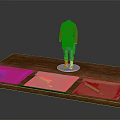 Red Top And Blue Bottom Mannequin With Three Fabric Stacks On Wooden Display Table