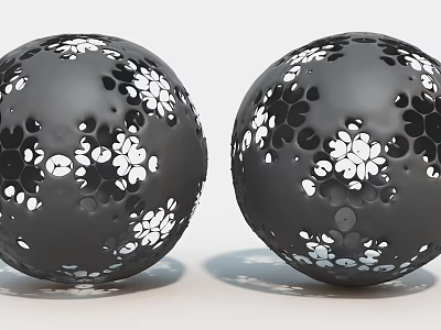 Dual Black Spherical Art Installation With Intricate Cutout Patterns And White Accents 3d model
