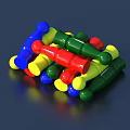 Colorful Plastic Figures In Blue Red Green And Yellow Piled On Dark Background