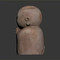 Pink Colored Man Statue with Hands in Prayer Position Closed Eyes on Neutral Gray Background