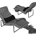 Gray Upholstered Lounge Chair With Black Metal Frame Polka Dot Pillow And Throw Blanket