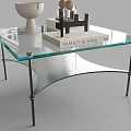 Modern Coffee Table With Glass Top Metal Legs And Decorative Items On Surface