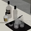 Whiskey Bottles And Crystal Glasses On Black Tray With Marble Countertop