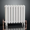 Classic White Radiator With Copper Bottom Connectors In Modern Home Interior