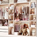 Organized Wardrobe with Hanging and Folded Clothes Dolls Stuffed Toys and Bookshelves