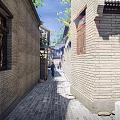 Ancient Architecture Features Traditional Alley With Brick Walls Classic Wooden Windows And Sunlight
