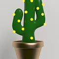 Green Cactus Plant With Yellow Dots In Golden Pot For Home Decoration