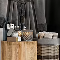 Black Front Load Washing Machine With Gray Robe Laundry Basket Wooden Table And Towels
