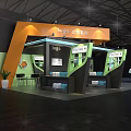 Company Exhibition Booth Design With Green Orange Accents And Product Displays