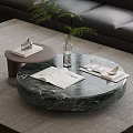 Round Green Marble Coffee Table With Books Vase Green Plant And Glasses On Gray Rug