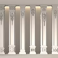 White Carved Columns Neatly Arranged Against Light Colored Walls With Lighting