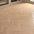 Herringbone Pattern Light Wooden Floor With Natural Wood Grain And Bright Lighting