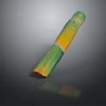 Carved Sculpture With Green And Yellow Long Bamboo Like Segments On Dark Background With Reflection