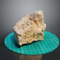 Natural Wooden Stone Block With Textured Surface On Green Grid Mat