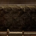 Rustic Stone Background Wall With Wooden Lattice Top And Pebble Floor Design
