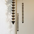 Layered Cone Shaped Modern Chandeliers Hanging In Room With Window Blinds