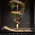 Red Brush Shaped Hanging Decoration With Spiral Design Green Foliage And Golden Accents