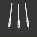 White Elongated Mechanical Components With Small Holes And Metal Tips On Black Surface