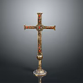Intricate Golden Cross Sculpture with Red and Green Inlaid Decorations on Ornate Base