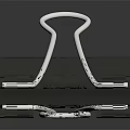 Silver Metal Paper Clip With Black Base And Reflective Surface For Office Use