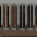 Column Capitals With Various Wood Grains And White Bases Arranged In Row