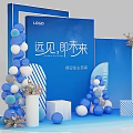 Brand Welcome Event Setup With Blue White Balloons Striped Decorations Flower Arrangements And Brand Logo