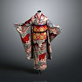 Traditional Kimono Garment With Red Black Patterns And Decorative Obi Belt