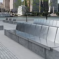 Modern Urban Landscape Seats With Metal Backrests Concrete Base And Waterfront View