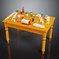 Assorted Food Items On Yellow Table With Bread Milk Eggs And Drinks