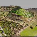 Vibrant Natural Terrain With Green Vegetation Rocky Outcrops And Varied Landforms