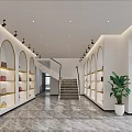 Modern Reception Space Interior With Marble Countertop And Display Shelves Holding Fashion Bags